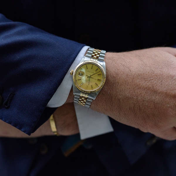 Salva wears his two-tone Rolex Datejust on a Jubilee bracelet. The dial is brushed gold and appears 