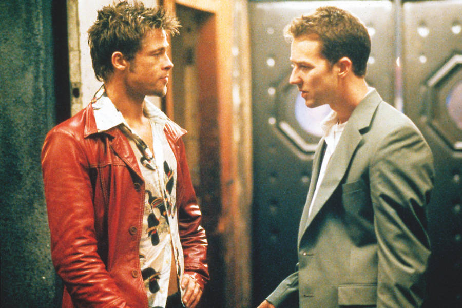 Brad Pitt pairs a camp collar Hawaiian shirt with a red leather jacket alongside Edward Norton in Fight Club, 1999. Photograph by Moviestore/REX/Shutterstock.