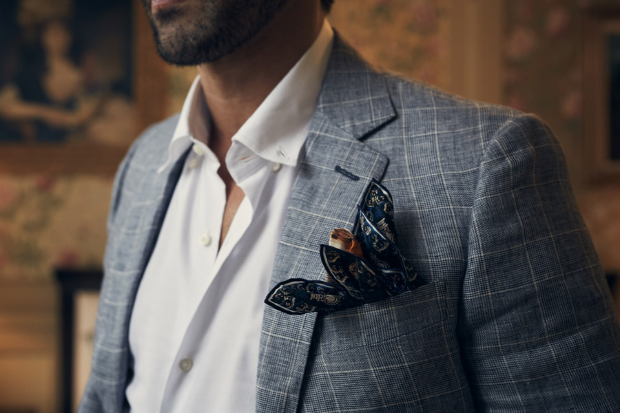 Blue checked linen jacket, Richard James; white cotton button-down shirt, Ign. Joseph; Queen Victoria coronation silk pocket square, Rampley & Co. Styling by Jo Grzeszczuk, photograph by Olivier Barjolle.
