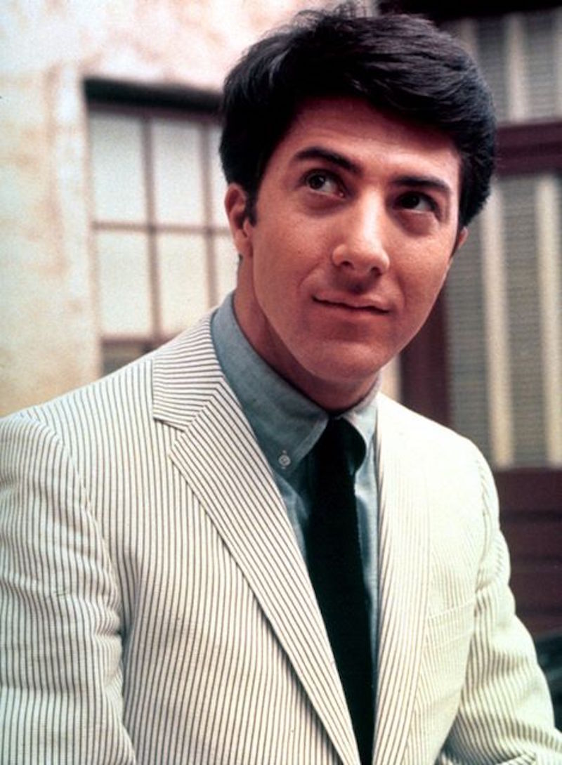 Dustin Hoffman wears a traditional seersucker jacket, paired with a button-down denim shirt and a black tie in 'The Graduate', 1967.