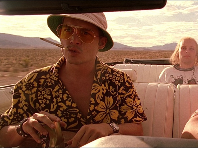 As Raoul Duke in the adaptation of Hunter S. Thompson’s novel Fear and Loathing in Las Vegas, Johnny Depp wears a Hawaiian shirt, aviator sunglasses and a bucket hat, 1998.