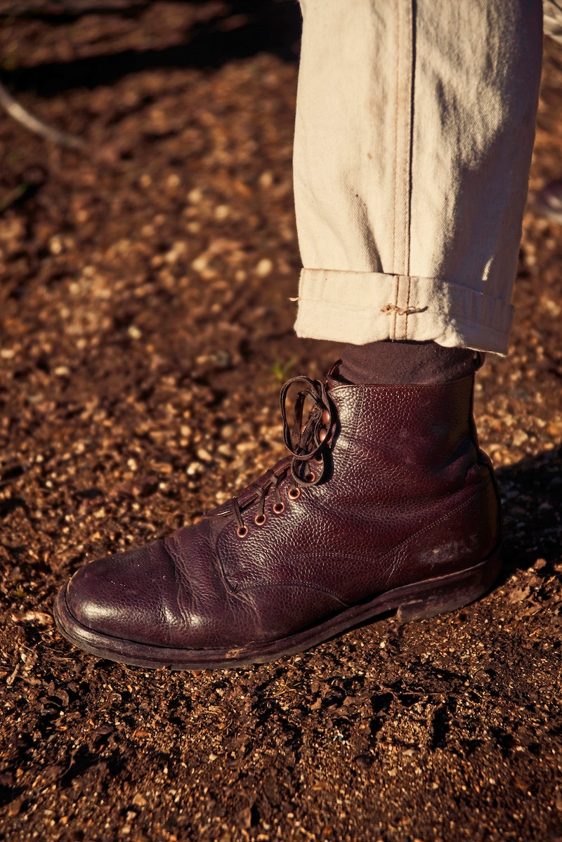 Handcrafted by Cheaney in the style of a WWI field boot, this pair is made from a ‘dark walnut’ grain leather, features Private White’s signature copper hardware, and is versatile enough to wear with casualwear or tailoring.