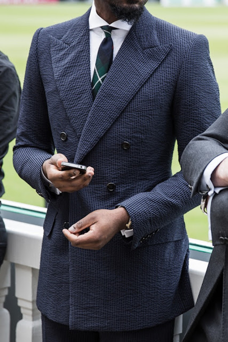 Bespoke tailor Michael Browne wearing a navy on navy double-breasted seersucker suit.