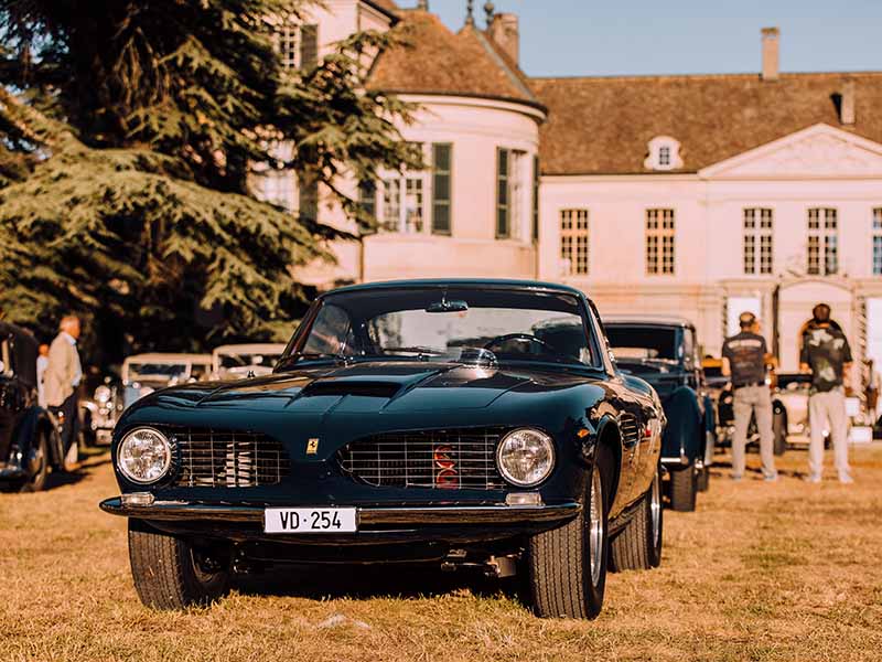 A classic Ferrari with round headlights at the Concours d’Elégance.