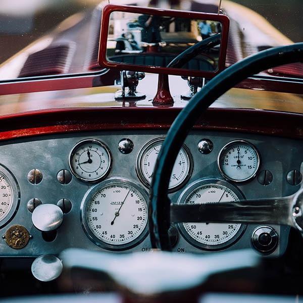 The stylish dashboard on a vintage car.