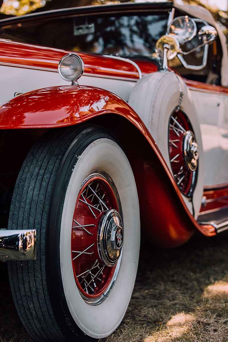 The two-tone exterior of a classic automobile.