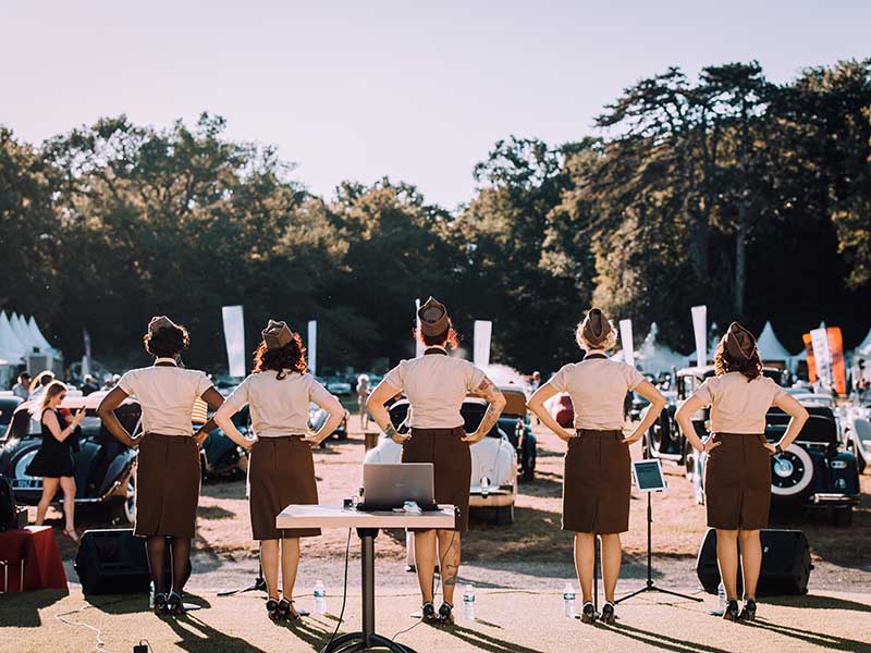 A troupe of 1940s reenactors performing for the crowd.