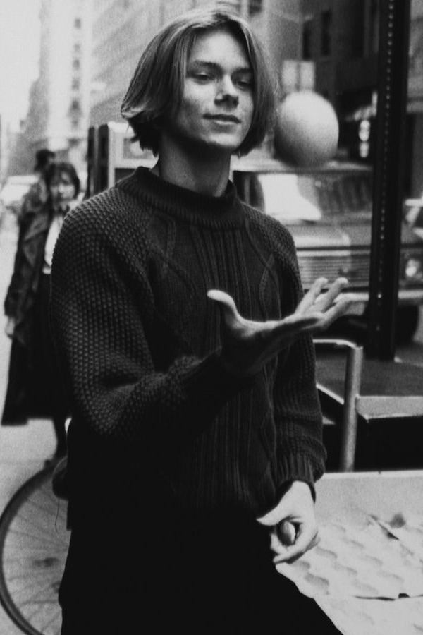 Phoenix wears a cable knit sweater in New York, circa 1990s. Photograph by John Roca