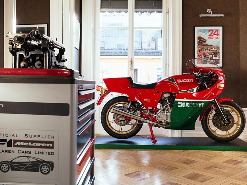 A red and green classic Ducati motorbike.