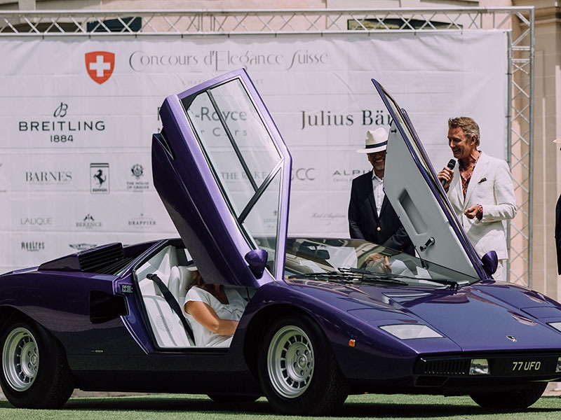 Simon inspecting a purple Lamborghini Countach.