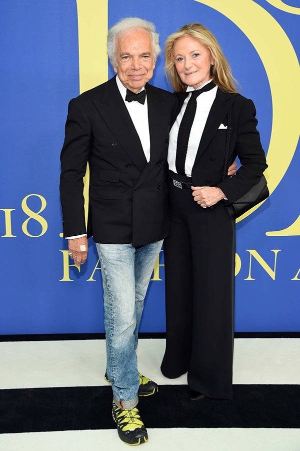 Ripping up the rule book, Mr Lauren, pictured with his wife Ricky, sported black tie from the waist up and faded jeans and hiking sneakers from the waist down. (Getty Images)