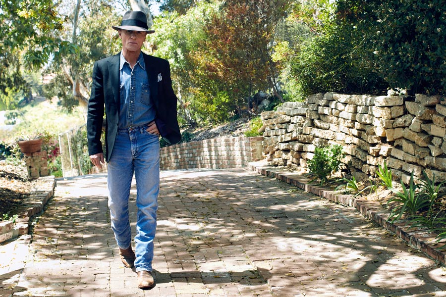 Black linen tuxedo jacket with silk lapels, Ralph Lauren Purple Label at Harrods; sky blue and white linen hand-printed pocket-square, Anderson & Sheppard Haberdashery. Blue denim shirt, blue denim jeans, Earl Grey felt hat and brown leather cowboy boots, all property of Ed Harris.