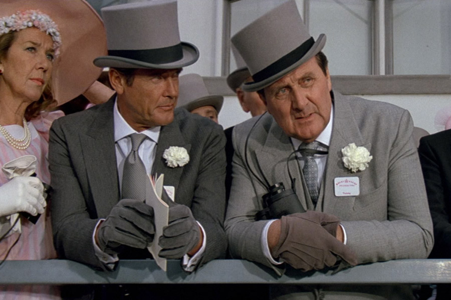 James Bond, played by Roger Moore, and Tibbett wearing grey morning suits at Royal Ascot in A View to a Kill, 1985.