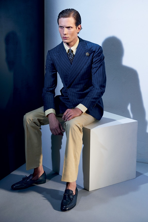 Navy wool double-breasted jacket, Sciamat; pale yellow linen shirt, Marol; navy silk tie with white diamond print, Francesco Marino for The Rake; beige cotton trousers, Anderson & Sheppard Haberdashery; navy calfskin leather gradient tassel loafer, Santoni.