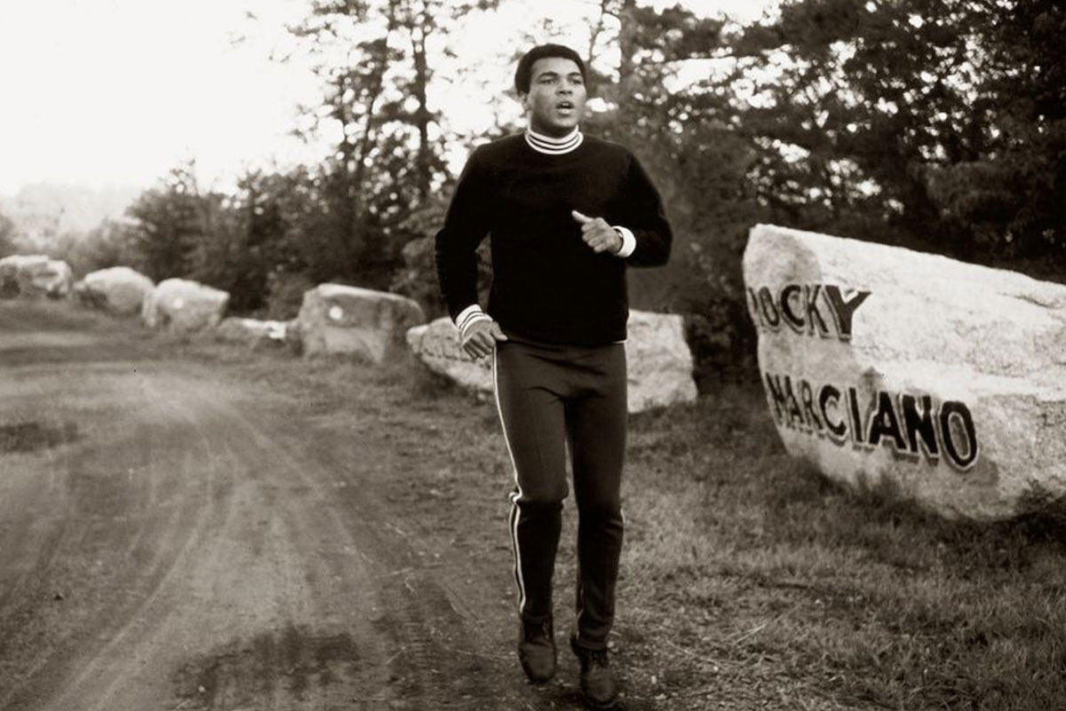 Muhammad Ali hits the road in a pair sweatpants at his training camp in Deer Lake, Pennsylvania.