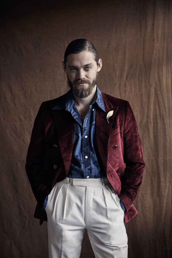 Bordeaux cotton and silk corduroy jacket, Caruso; blue cotton print shirt, Brooks Brothers, white cotton trousers, Anderson & Sheppard Haberdashery.