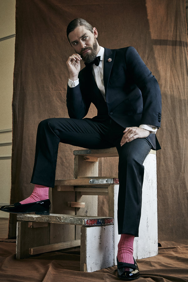 Midnight blue wool and mohair evening suit and black silk bow tie, both Hackett; white cotton evening shirt, Turnbull & Asser; pink cotton socks, Pantherella; black patent leather bow pump dress slippers, George Cleverley.