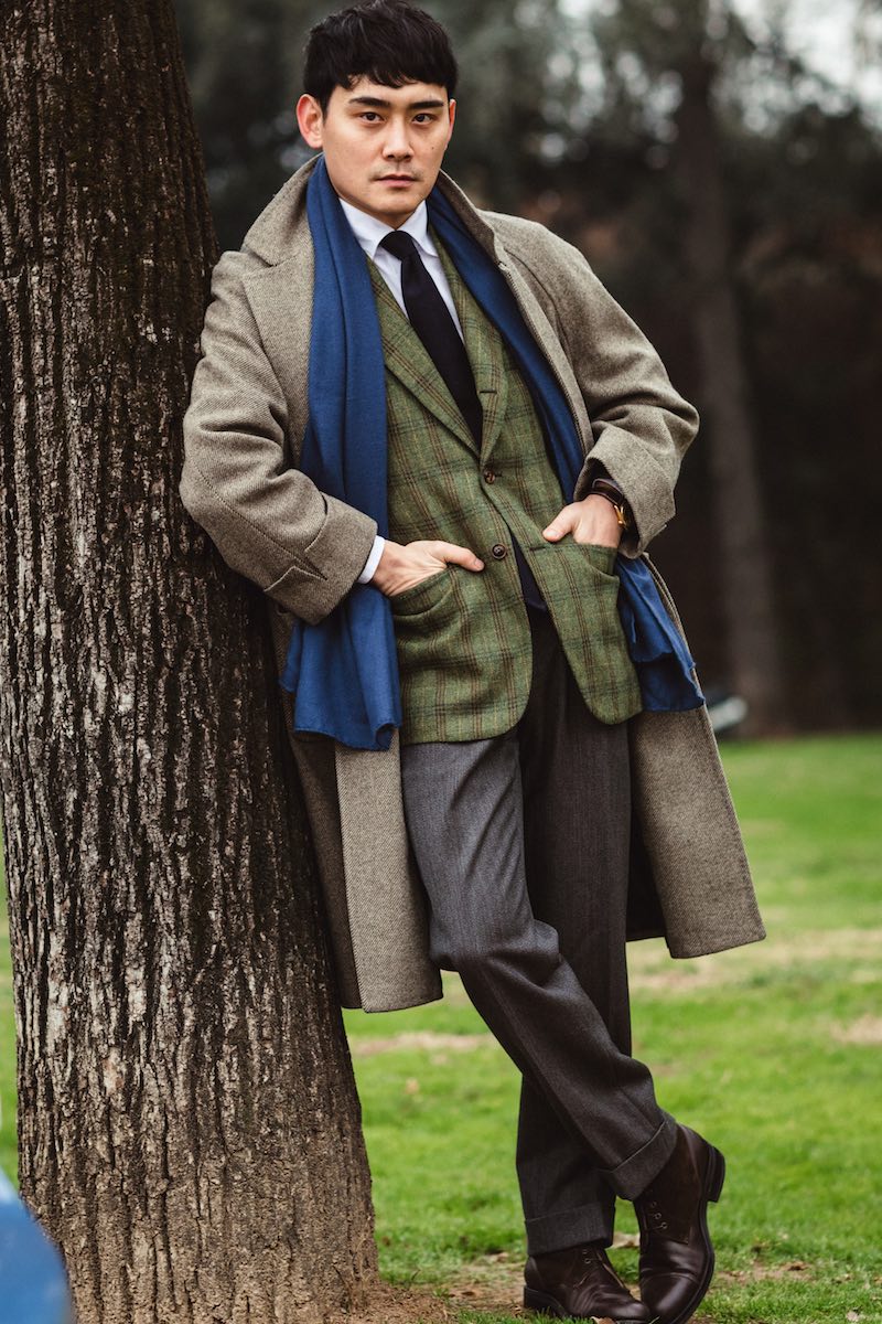 A classic ensemble of grey flannel trousers with a navy blazer, which allows a casual denim shirt to work seamlessly together.