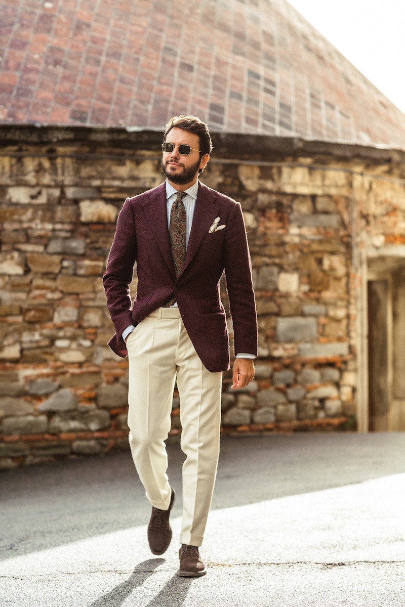 Mikolaj Pawelczak perfectly clashes a navy and brown gun club check jacket with a butcher stripe shirt and navy woven tie.