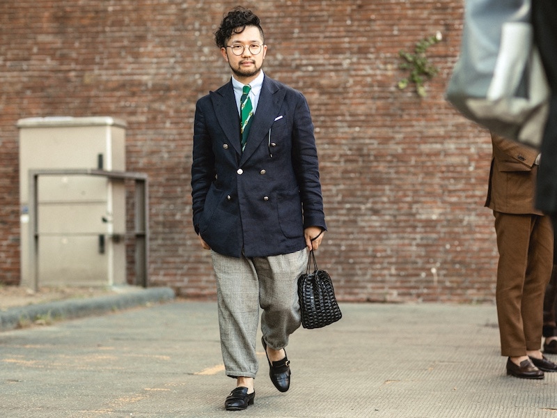 Proportions and fit are clearly understood here with a wide-leg and cropped Prince of Wales flannel trouser with a full cut navy blazer.