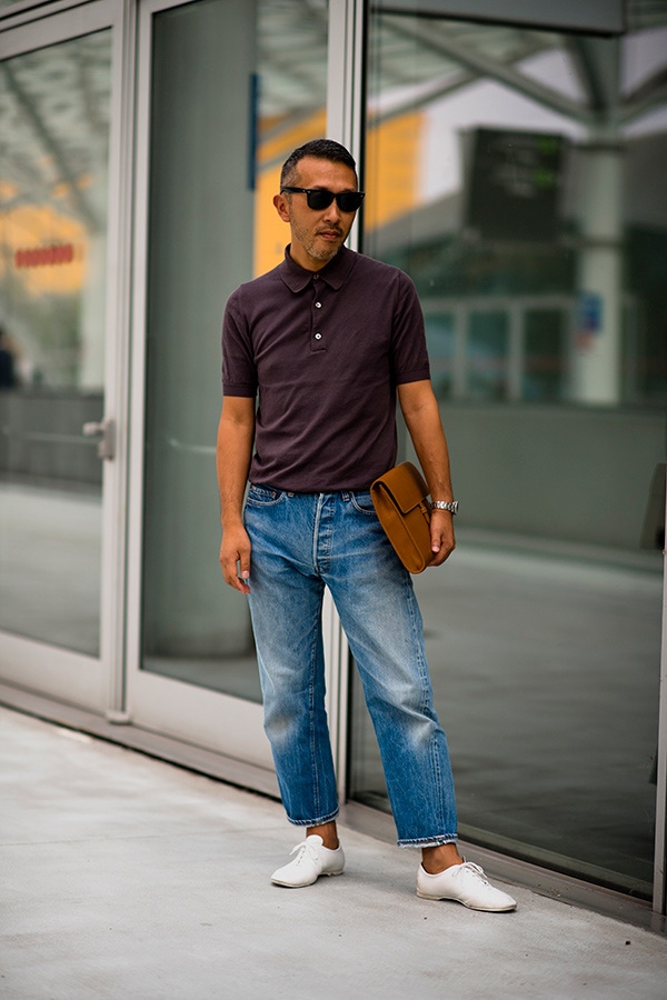 Cropped jeans typically work best with a few rolls above the ankle, but this gentleman has opted for a cropped jean to begin with and has added just a single subtle turn-up. Note, these jeans have a twisted seam, which allows for a better drape when cropped.