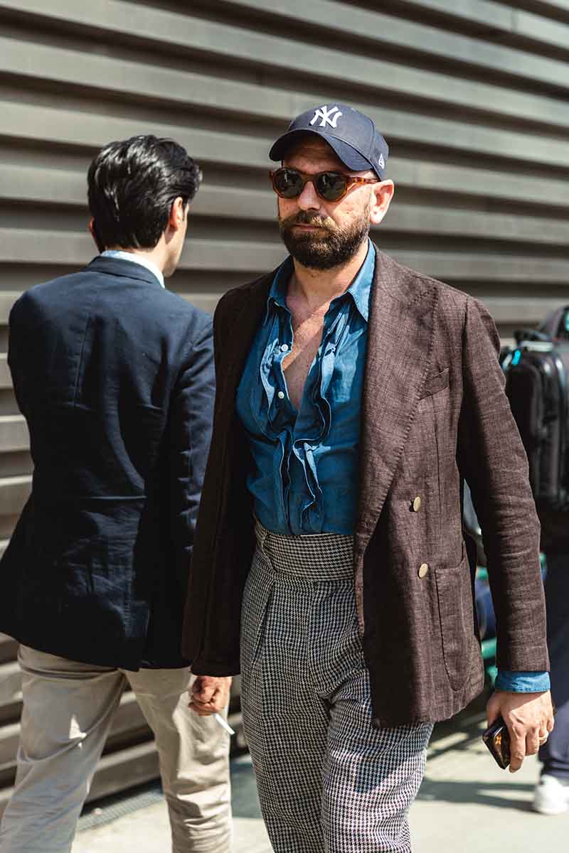 A denim shirt can be an opportunity to introduce texture such as ruffles and pleats. By co-ordinating the colours of your top half carefully, you can introduce an understated pattern via your trousers.