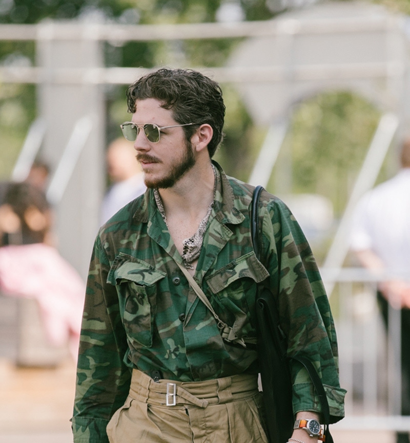 Photographer Robert Spangle embellishes his military garb with a nonchalantly slung bandana.