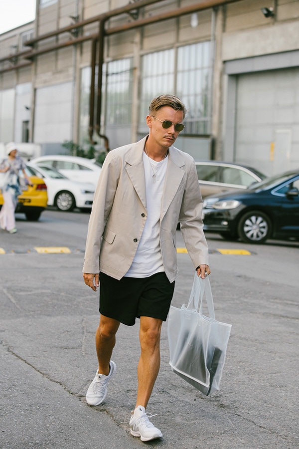 Beige on white makes for an easy palette to offset stronger colours against, as this young man demonstrates.