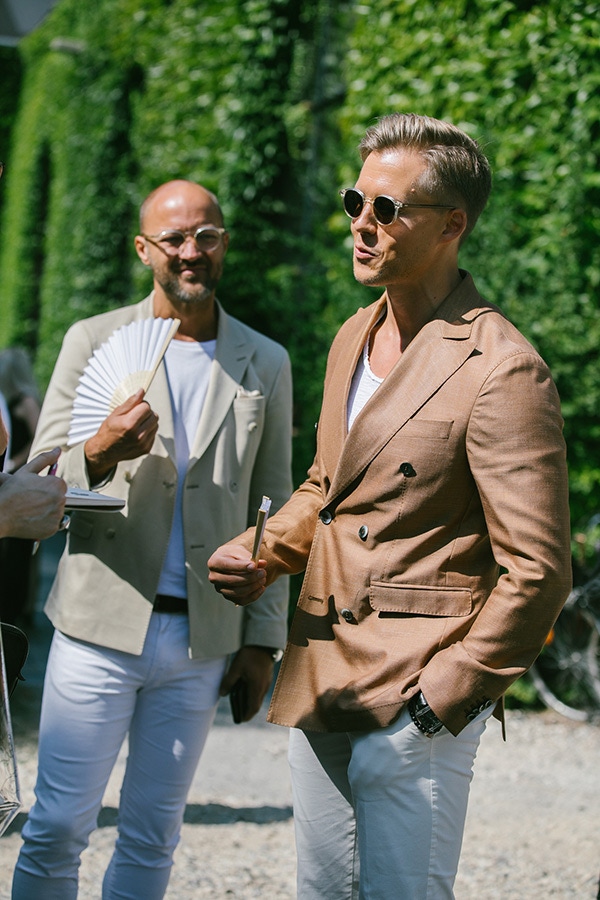 The white T-shirt subtly dresses down summer suiting while still looking as crisp, if not as formal, as a collared shirt.