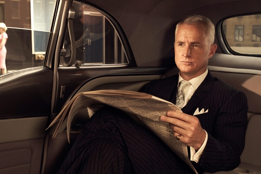 Sterling makes a powerful statement with his expertly groomed silver hair and triple folded pocket square.