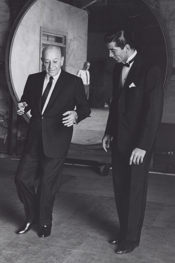 Showing off his dancing with actor Ray Danton, who portrayed Raft in The George Raft Story, 1961. Photograph by Alamy.