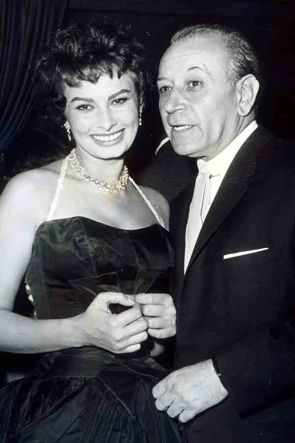 With Sophia Loren, circa 1960s. Photograph by Rex Features.