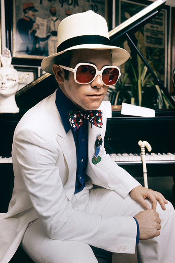 Elton John wears a Nutters of Savile Row suit.