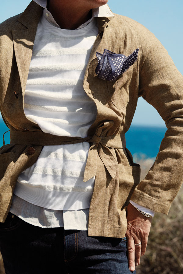 Beige linen single-breasted jacket, Lardini at The Rake; cream cotton textured striped jumper, Corneliani; grey linen shirt, Brunello Cucinelli; true blue cotton denim jeans, Dolce & Gabbana; navy and white cotton diamond print pocket-handkerchief, Anderson & Sheppard Haberdashery. Styling by Jo Grzeszczuk, photograph by Neil Gavin.