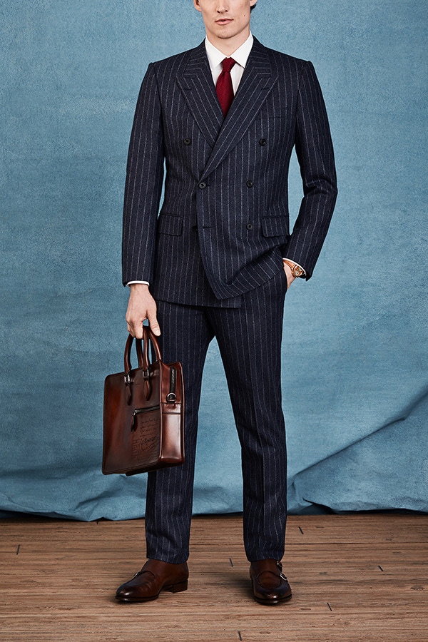 Mr Porter's business look features a timeless double-breasted navy blue pinstripe suit which beautifully offsets the tan elements of the watch.