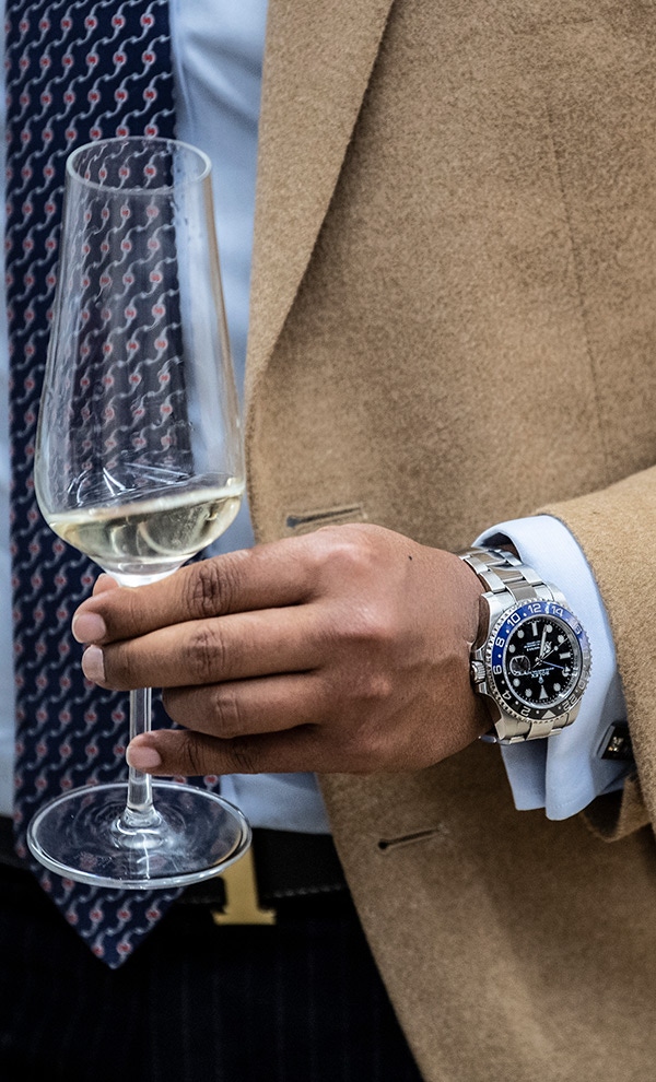 Cashmere blazer, champagne and Rolex - a holy trinity if ever there was one.