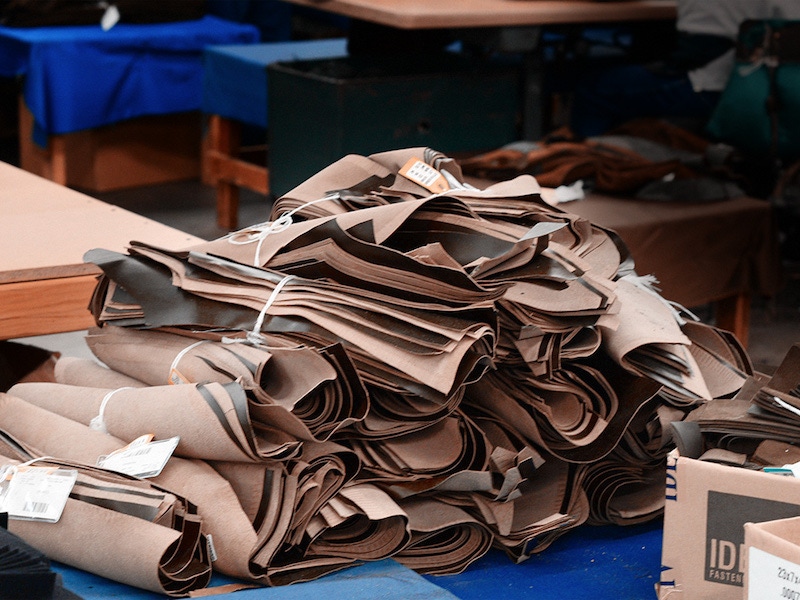 Bundles of parts that have been cut by hand waiting to be assembled.