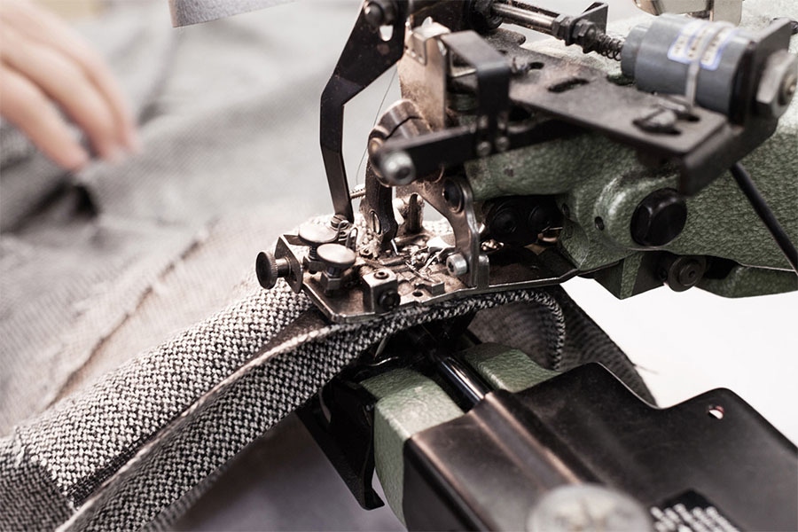 The manufacturing process in Indre, where the Hervier family are responsible for manufacturing trousers and tailored pieces.