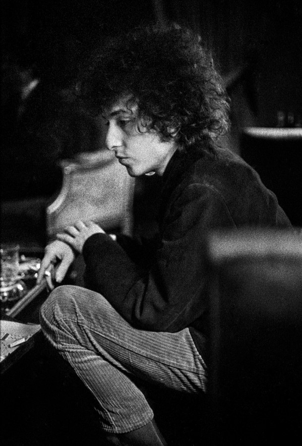 Dylan smoking a cigarette during a break inside Schatzberg's photography studio in the 1960s. © Jerry Schatzberg. Courtesy of ACC Art Books.