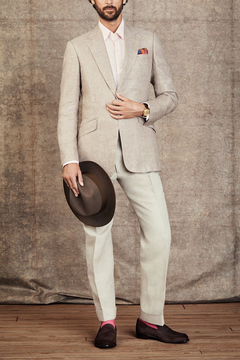 The Watch Enthusiasts' Gathering: Jacket by Huntsman; Shirt by Emma Willis; Pocket Square by Rubinacci; Hat by Lock & Co; Trousers by Edward Sexton; Socks by The London Sock Company; Loafers by Cheaney; Watch is a Rolex ‘Padellone’ ref 8171, circa 1951 with two-tone dial in 18k yellow gold.