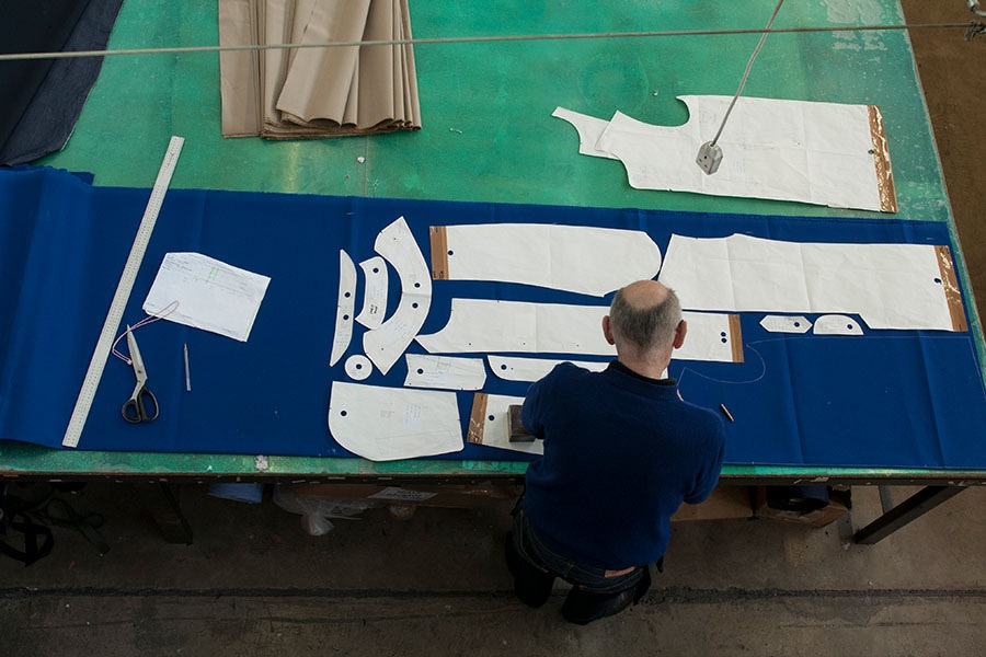 Once the bonded cotton arrives at the Mackintosh factory the patterns are laid out and marked up.