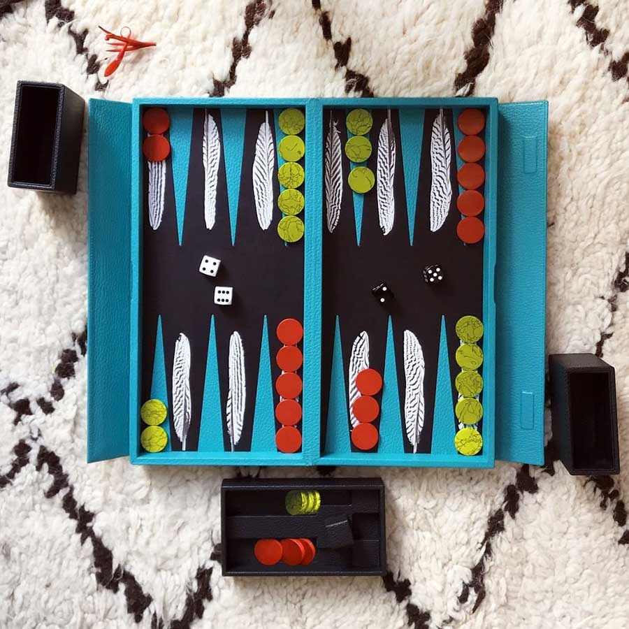 The Turquoise Leather Silver Pheasant Travel Backgammon set will keep you entertained on the go.