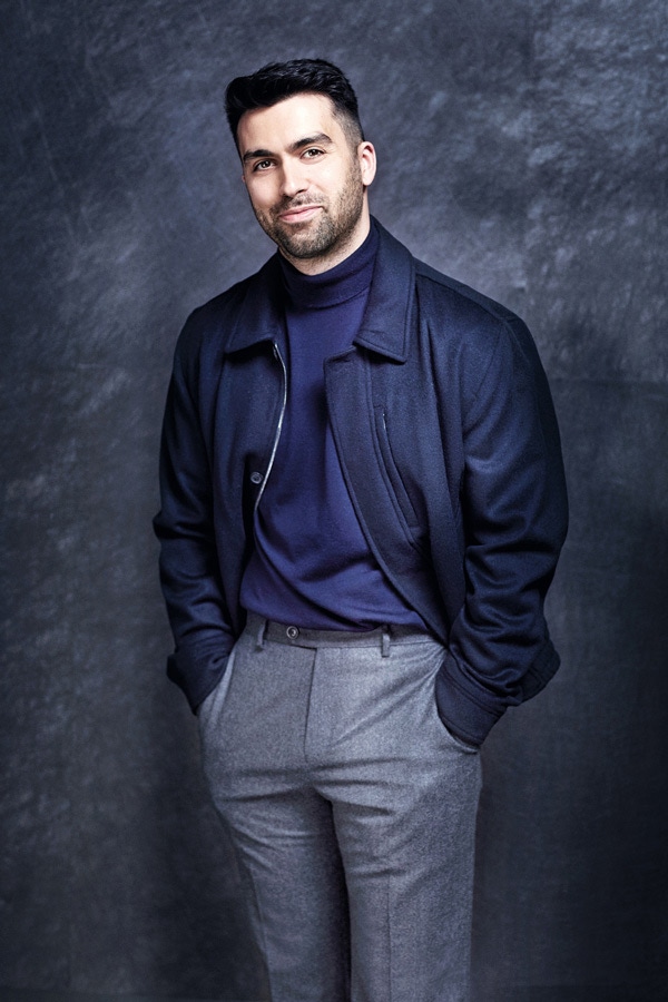 Navy Merino wool roll-neck, Emporio Armani at Harrods; navy wool blouson and charcoal flannel trousers, both Gieves & Hawkes.