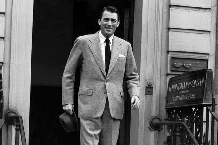 Gregory Peck leaves H. Huntsman & Sons at No. 11 Savile Row.