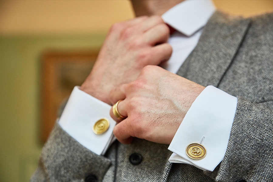 Elizabeth Gage's gold coin cufflinks make for a striking addition to suiting.