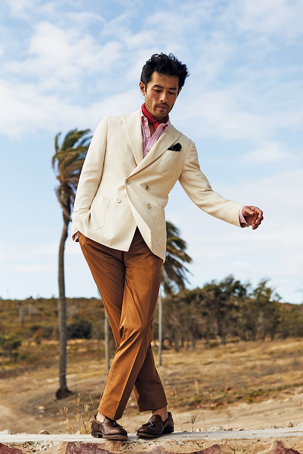 Cream wool and cotton unlined double-breasted jacket, Lardini; red and white linen button-down shirt; Turnbull & Asser; tan Vaughn cotton trousers, New & Lingwood; red cotton dotted neckerchief, Anderson & Sheppard; dark brown burnished calf Cavendish loafers; Crockett & Jones; pocket-square, property of The Rake.