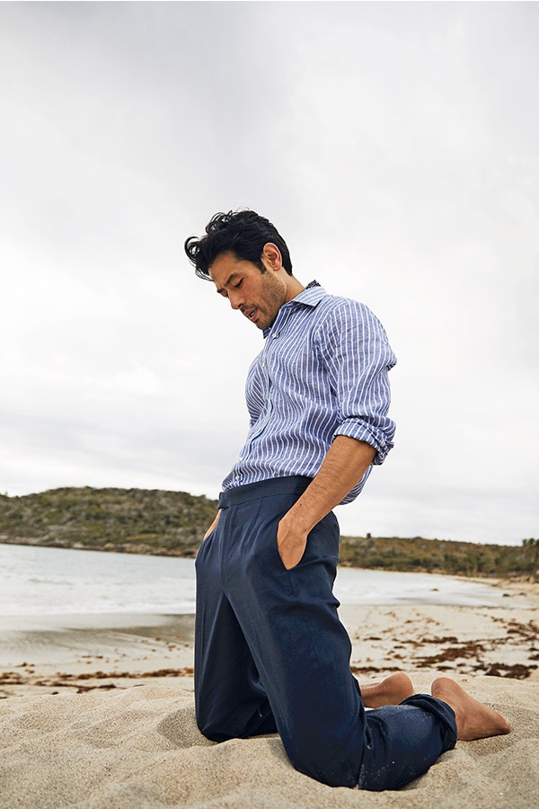 Navy linen flat-front trouser and navy cotton mosaic neckerchief, Anderson & Sheppard; blue and white stripe linen shirt; Turnbull & Asser.