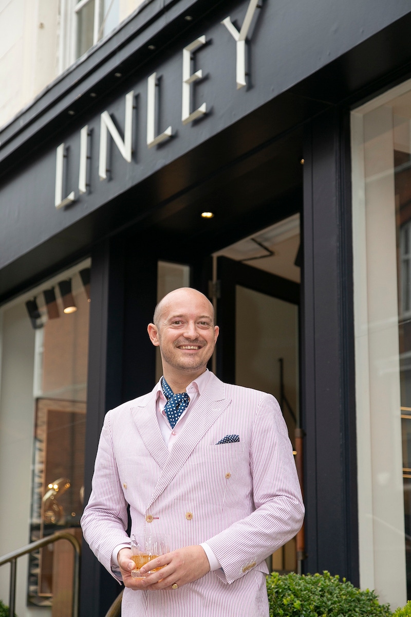 Max Warner on the steps of Linley's showroom on Chelsea's Pimlico Road.