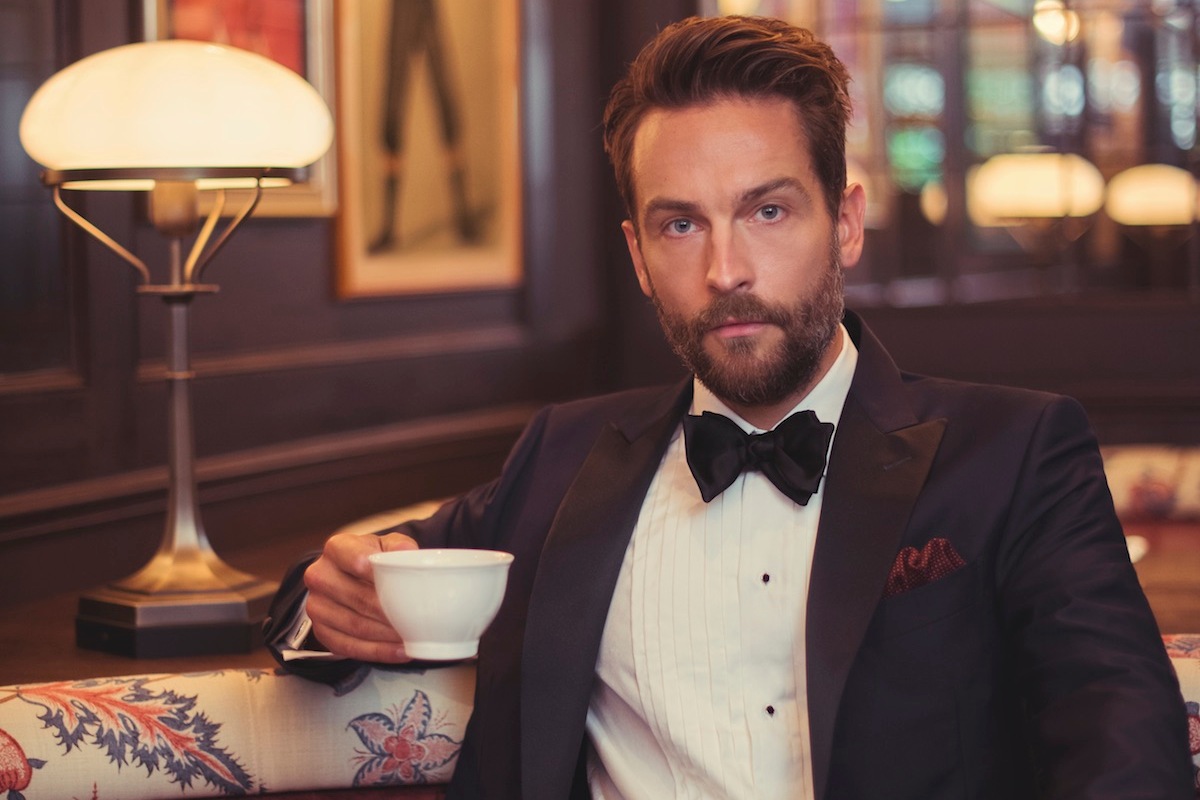 Navy and black silk dinner suit, Corneliani; cream silk dress shirt, black satin bow tie and onyx and silver dress studs and cufflinks, Budd Shirtmakers; burgundy cotton spotted handkerchief; Anderson & Sheppard.