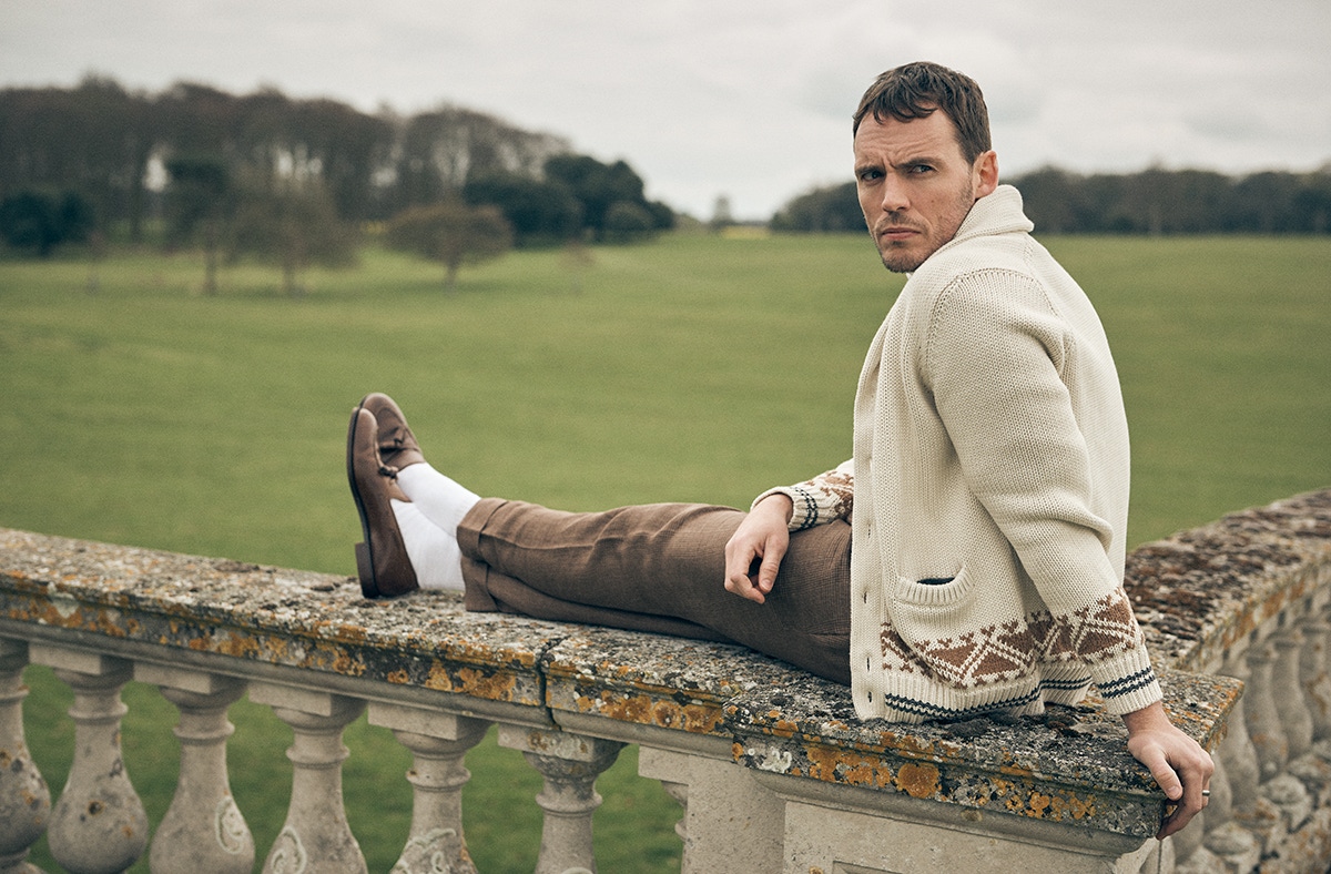 Cream wool cashmere cardigan and brown wool check trousers, Brunello Cucinelli; tan leather tassel loafers, Crockett & Jones.